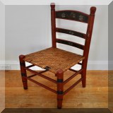 F92. Painted ladder back chair with woven seat. Some of the weaving is broken. 36”h - $38 